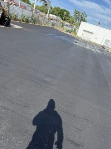 Newly paved parking lot beside commercial building